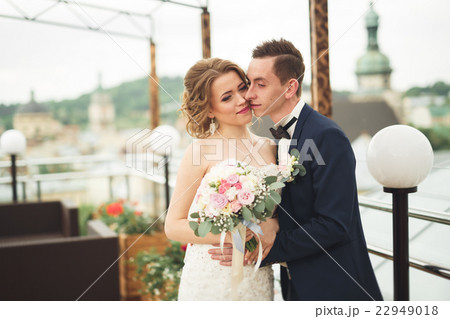 Beautiful couple, bride and groom posing on Beautiful couple, bride and groom posing on 22949018