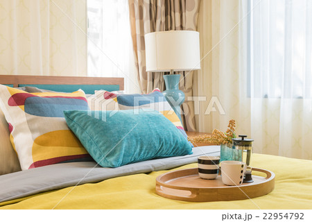 colorful pillows on wooden bed in modern bedroom colorful pillows on wooden bed in modern bedroom 22954792