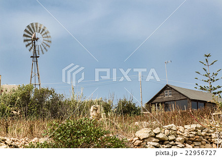 Simple dwelling with a wind turbine Simple dwelling with a wind turbine 22956727