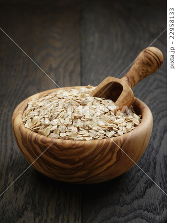 oat flakes in wood bowl on oak table 22958133