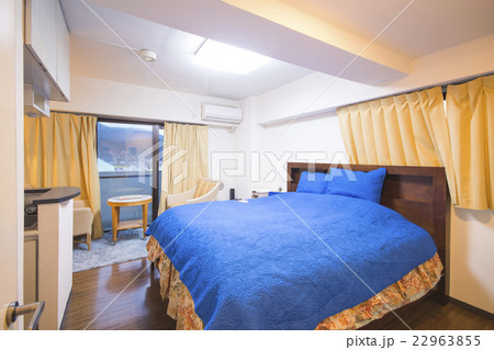 interior of bedroom with blue bed linen interior of bedroom with blue bed linen 22963855