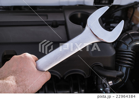 Wrench in hand with shallow depth of field Wrench in hand with shallow depth of field 22964384