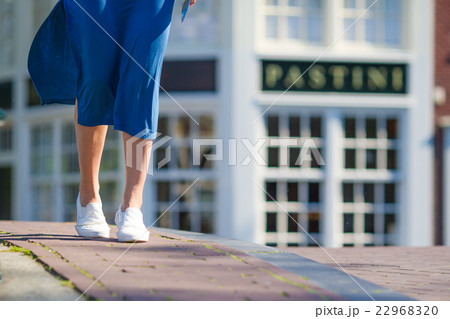 Young beautiful girl walking on bridge in european Young beautiful girl walking on bridge in european 22968320