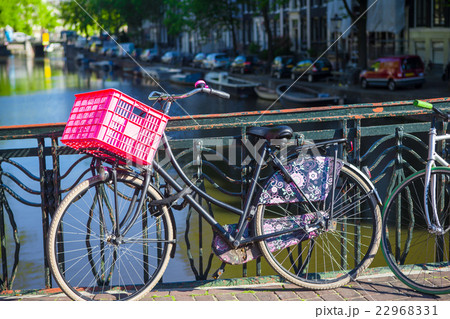 Colorful bikes on the bridge in Amsterdam Colorful bikes on the bridge in Amsterdam 22968331