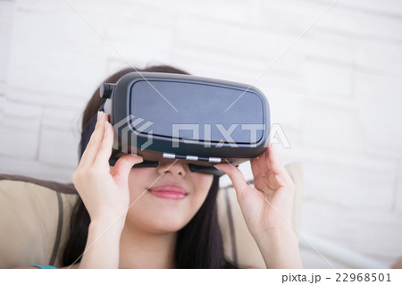 woman using VR headset glasses 22968501