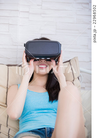 woman using VR headset glasses woman using VR headset glasses 22968502