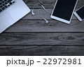multiple devices phone laptop and tablet on wooden 22972981