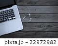 Laptop computer on a wooden desk, top view  22972982