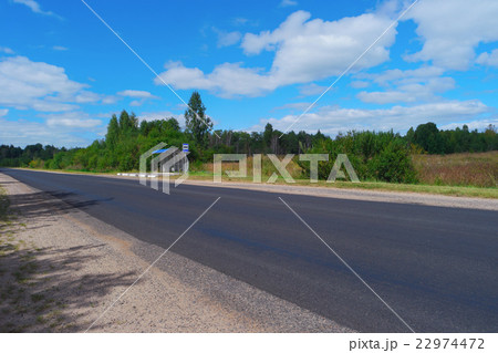 Empty highway with bus stop Empty highway with bus stop 22974472