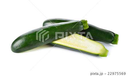 whole and half cut fresh Zucchini on white whole and half cut fresh Zucchini on white 22975569