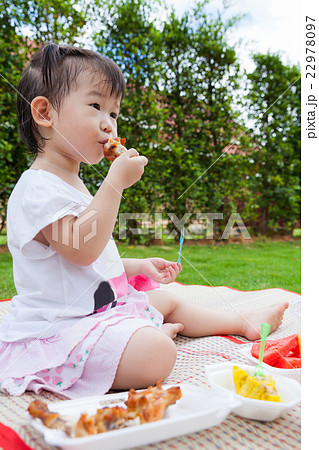 Little asian (thai) girl enjoy eating her lunch Little asian (thai) girl enjoy eating her lunch 22978097