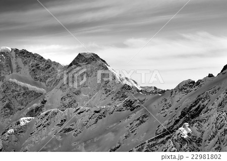 Black and white high mountains in winter evening Black and white high mountains in winter evening 22981802