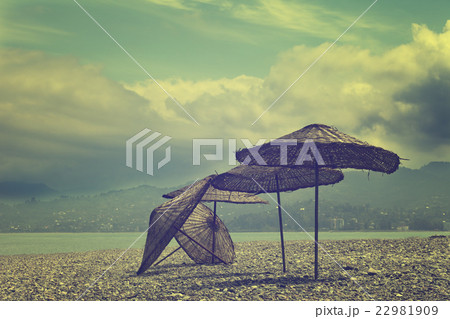Old sunshade on deserted beach 22981909
