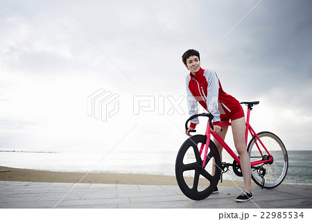 Young woman at seashore enjoying recreation time Young woman at seashore enjoying recreation time 22985534