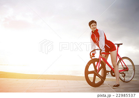 Female enjoying weekend stroll on rental bike Female enjoying weekend stroll on rental bike 22985537