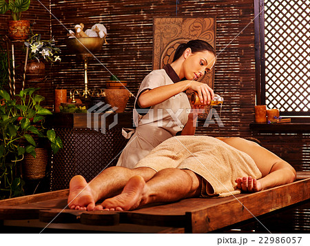Man having Ayurvedic spa treatment. 22986057