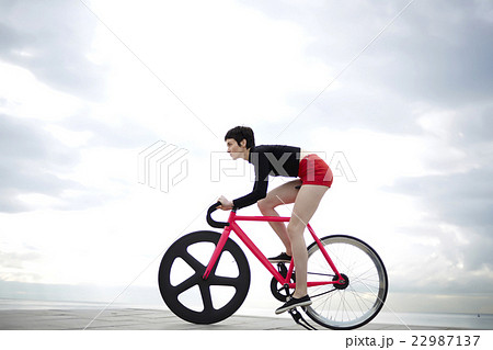 Stylish hipster girl is riding on the beach Stylish hipster girl is riding on the beach 22987137