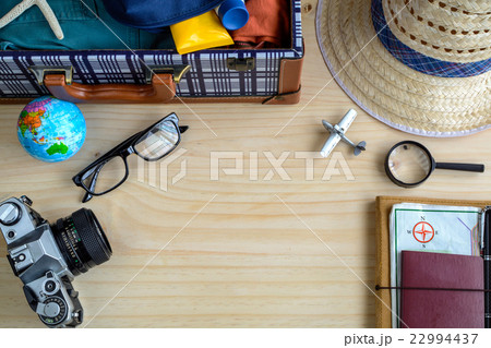 Outfit of traveler on wooden background Outfit of traveler on wooden background 22994437