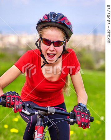 Bicyclist girl rides bicycle out city. Bicyclist girl rides bicycle out city. 23003728
