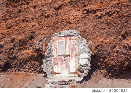 Doors leading into the hill at Red beach Santorini 23004885