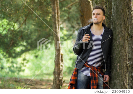 Smoking guy with a cigarette Smoking guy with a cigarette 23004930