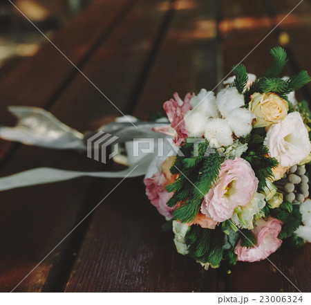 Wedding bouquet on a bench Wedding bouquet on a bench 23006324