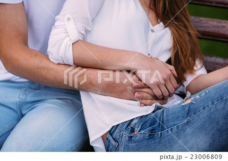 man and woman on a bench in the park man and woman on a bench in the park 23006809