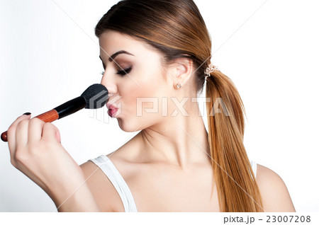 Emotional portrait of a young beautiful girl  23007208