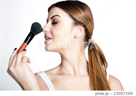 Emotional portrait of a young beautiful girl  23007209