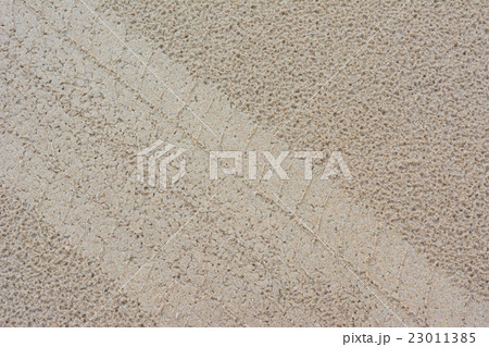 Tire from tracks on the sand background 23011385