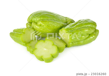whole and sliced fresh chayote on white background 23016260