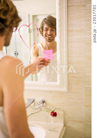 Boyfriend discovering a love message on the mirror Boyfriend discovering a love message on the mirror 23017785