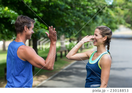 Fit people doing high five Fit people doing high five 23018853