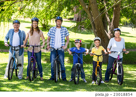Smiling family with their bikes Smiling family with their bikes 23018854