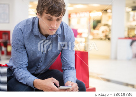 Man using mobile phone 23019736