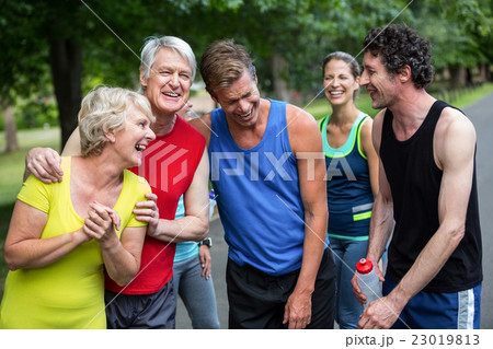 Marathon athletes posing and laughing Marathon athletes posing and laughing 23019813