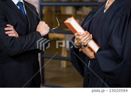 Lawyer holding a law book Lawyer holding a law book 23020564
