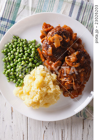 Salisbury steak with potatoes and green peas  23026203