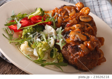 Salisbury steak with mushroom sauce and vegetables 23026218