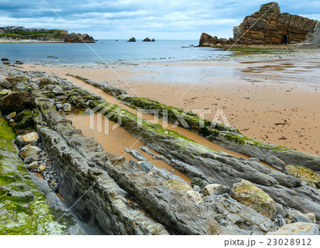 Portio Beach coastline landscape. 23028912