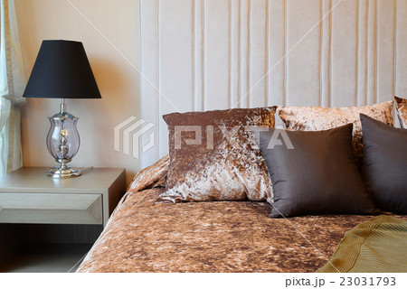 bedroom interior with tweed brown pillows on bed 23031793