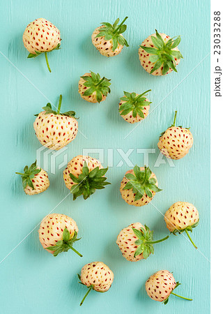 Fresh pineberries on turquoise Fresh pineberries on turquoise 23033288