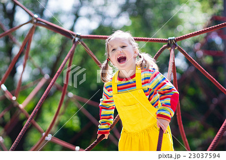 Child having fun on school yard playground 23037594