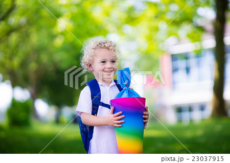 Little child with candy cone on first school day 23037915