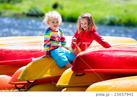 Two kids on piles of kayak Two kids on piles of kayak 23037942