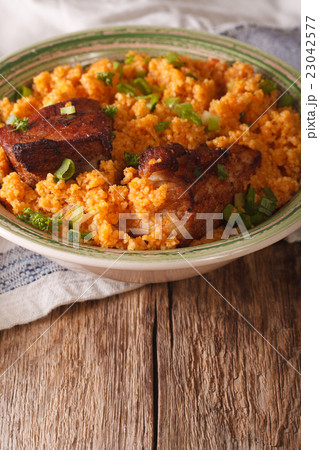 Spicy bulgur with beef close-up on a plate Spicy bulgur with beef close-up on a plate 23042577