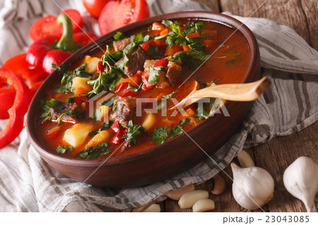 Hungarian goulash soup bogracs close-up in a bowl 23043085