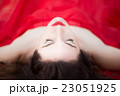 Lady in Red Dress Laying Down Eyes Closed Relaxed Sleeping 23051925