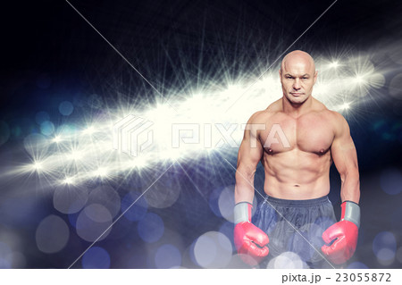 Composite image of full length portrait of musular boxer Composite image of full length portrait of musular boxer 23055872
