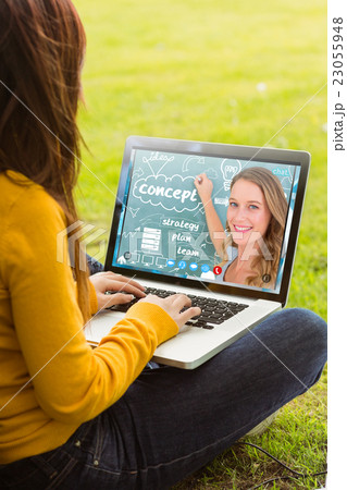 Composite image of woman using laptop in park 23055948